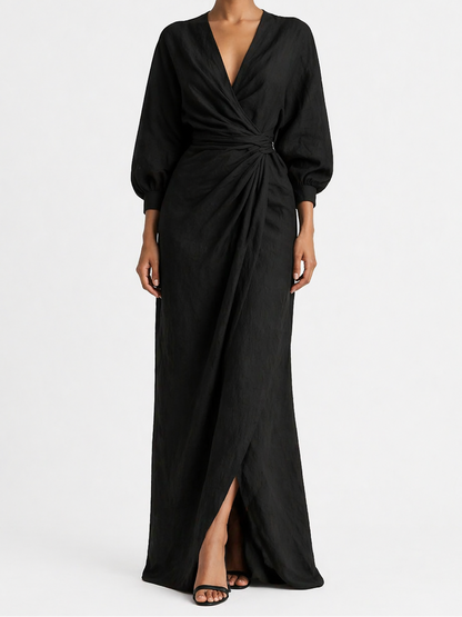 Woman wearing a black wrap dress on a white background